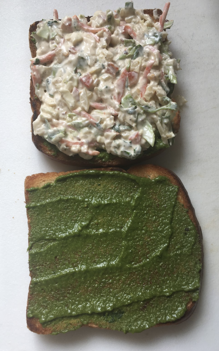 Put the prepared dahi mixture onto the chutney Close the sandwich with the other bread Now lightly butter one side of sandwich Heat up tavaa or skillet again Place sandwich ( buttered side down ) onto the tavaa and toast the sandwich until golden and crispy Lightly butter the top of sandwich and flip Toast the other side as well