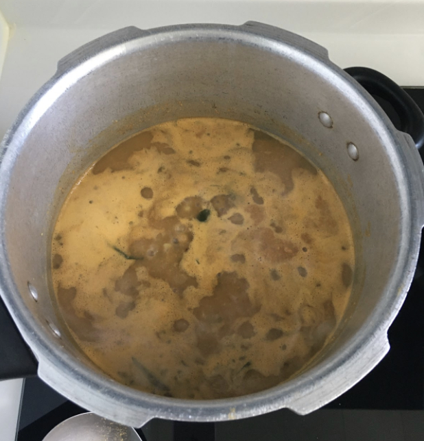 Mix well Add jaggery Adjust seasoning Cook for another 4-5 mins Heat oil in the pan for tempering Add mustard seeds Once mustard seed crackle add Hing and curry leaves Pour this Tadka over the curry Your delicious and healthy Muga Gathi is ready Enjoy with Puris