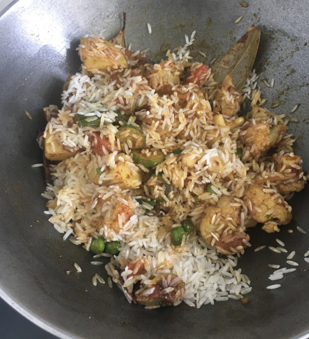 Add hot water ( enough to cook rice and vegetables) Cover and cook on low flame until rice and vegetables are cooked(10-14 mins)