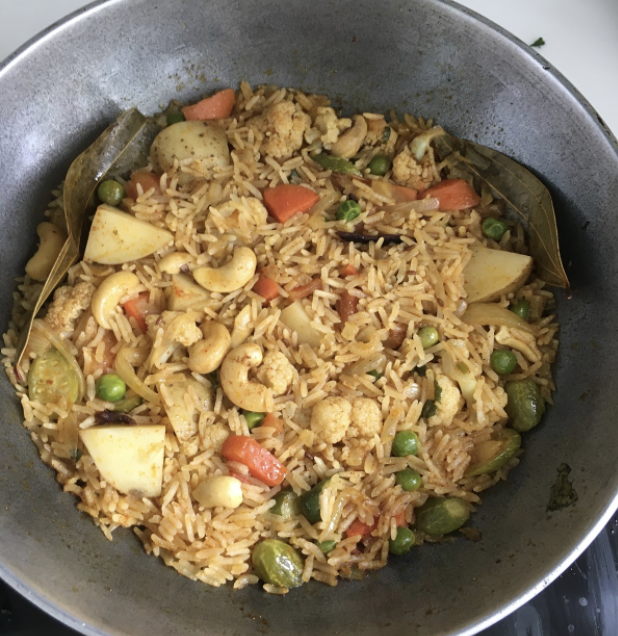 Open the lid. Add ghee and garnish with fresh coriander and grated coconut Your easy and delicious Masale Bhat is ready.