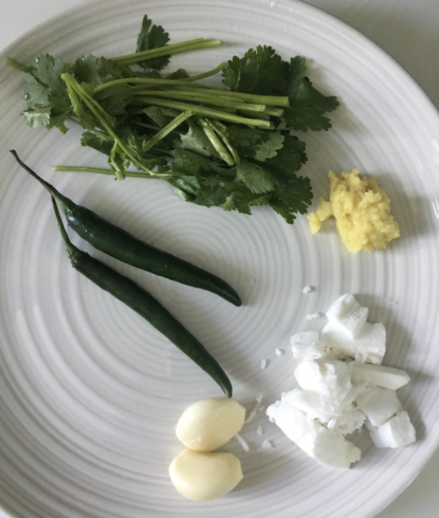 1cup Sabut Masoor ( soaked) 2 tsp fresh grated coconut 1-2 green chilies 1-2 large garlic cloves 1inch ginger fresh coriander 1medium onion, grated 1medium tomato, grated
