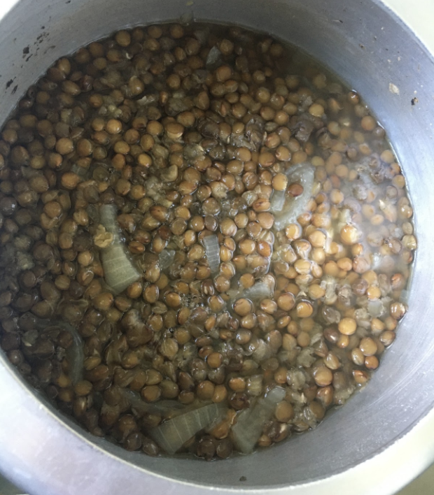 coarsely grind green chili, coriander, garlic, ginger, and coconut