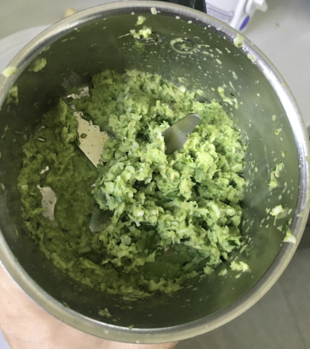 Keep aside Heat oil in a pan Add bay leaves Add grated onion Fry for few mins until onion turns golden brown Add the coarsely ground coconut paste Fry for 1 min Add turmeric, chili powder, Kanda lasun masala, and salt Fry for 1-2 mins Add tomato Fry until oil separates from sides of the pan