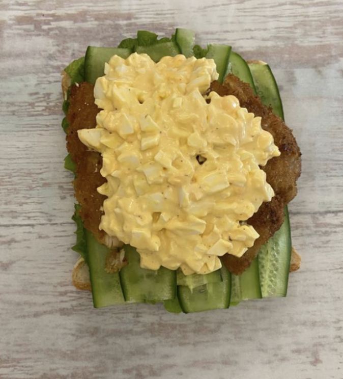 Place the whole boiled egg in the center
