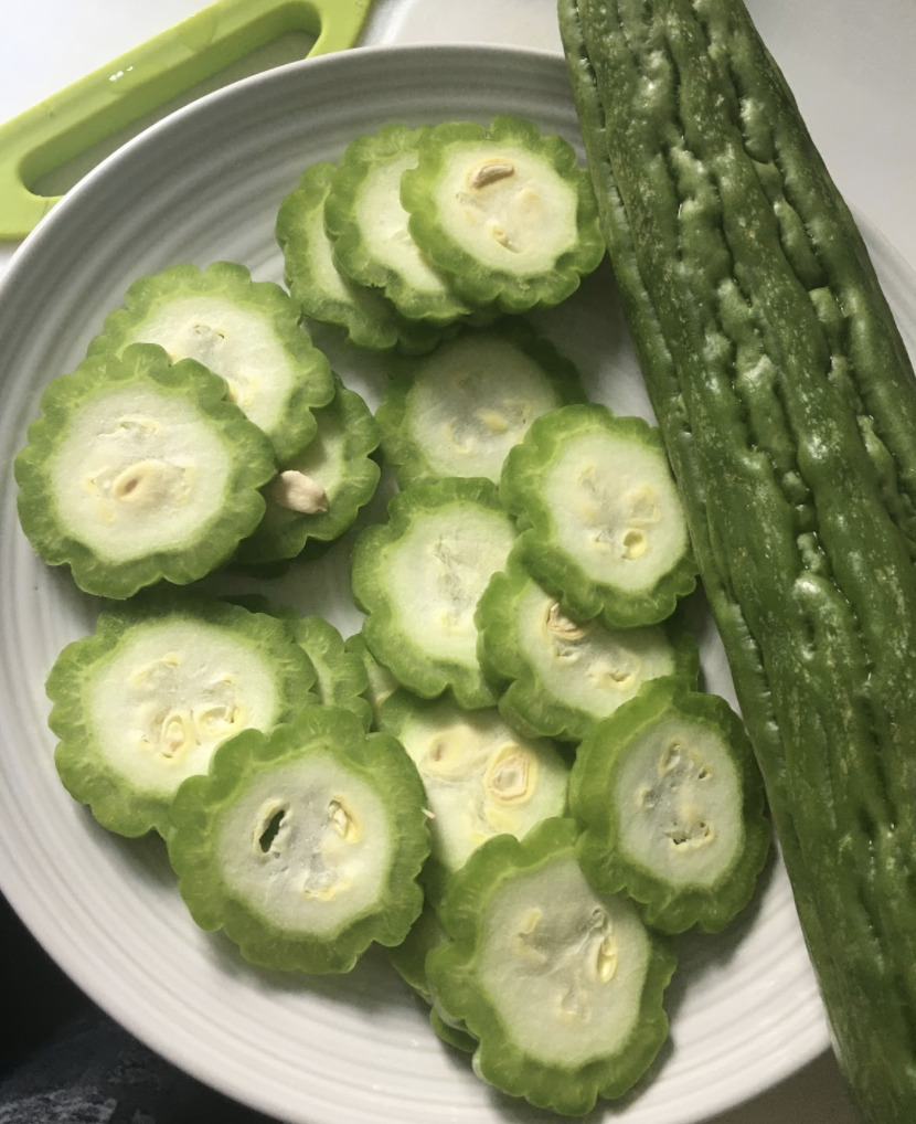 Add 1tsp salt to the Karela . Mix well and keep aside for 1hour Squeeze excess water from the Karela slices Mix all the flours and powdered spices