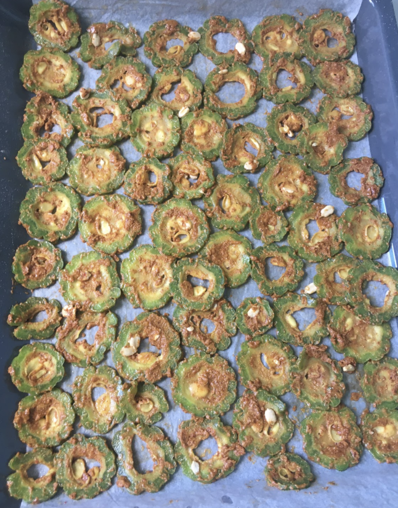 Bake at 350 F for 20-25 mins Remove tray carefully and flip the slices over to the other side Now brush some oil on the Karela slices Bake again fo 15-20 mins or until crispy