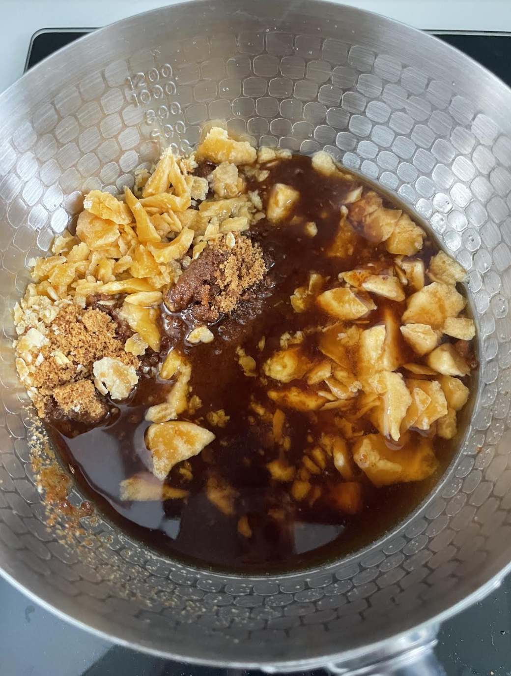 Cooking jaggery syrup with spices