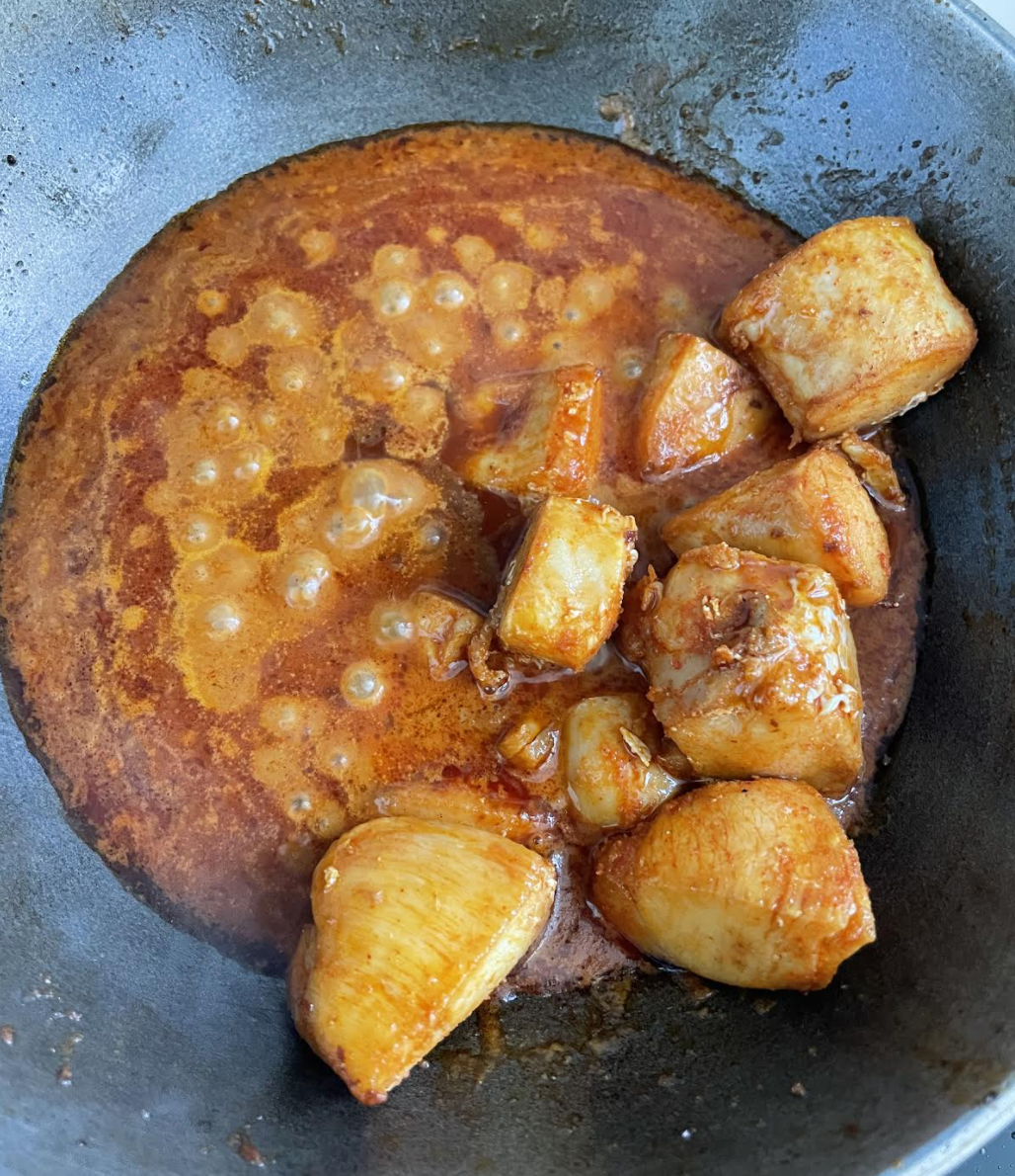 Simmering chicken curry