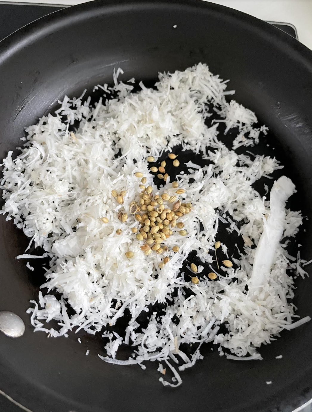 Grinding roasted coconut mixture