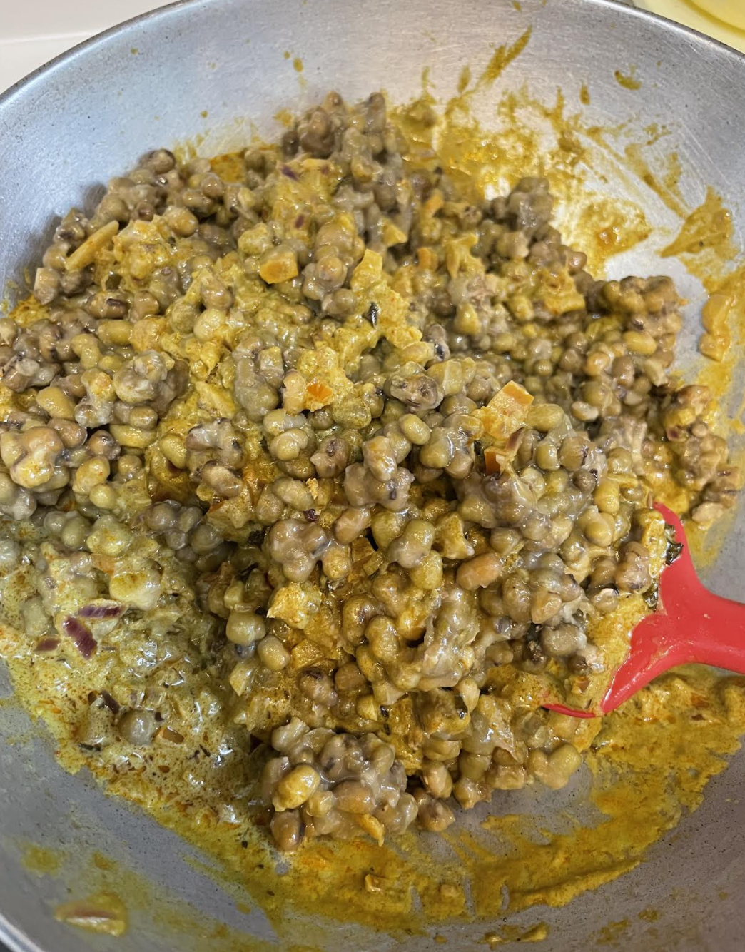 Finishing the green moong curry