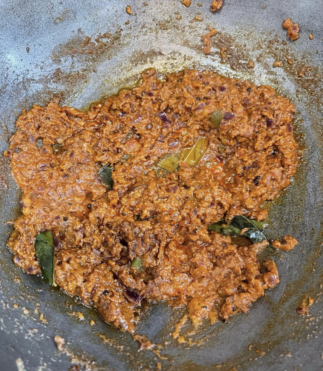 Adding fried tendli to the gravy