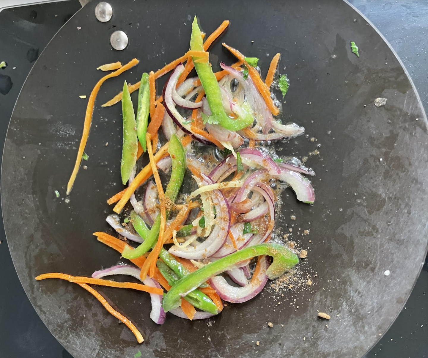 Mixing Nutrela sabzi with tadka